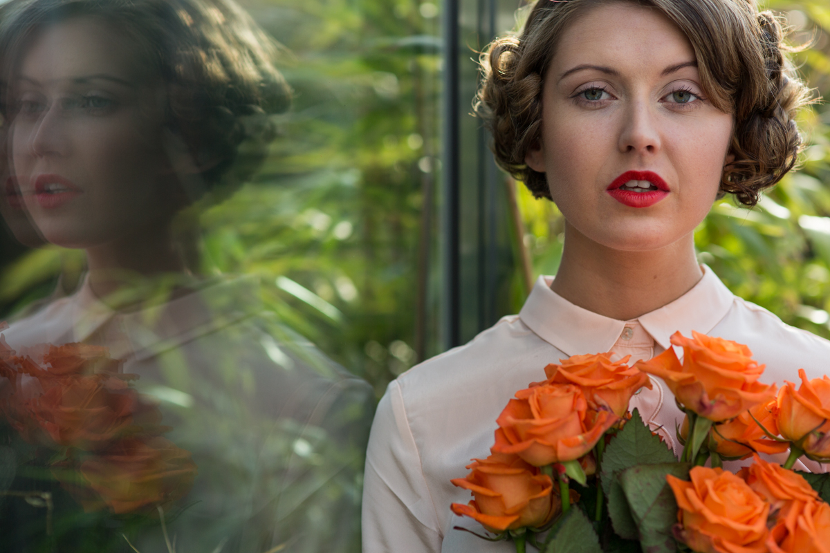 1930s inspired styling with orange roses
